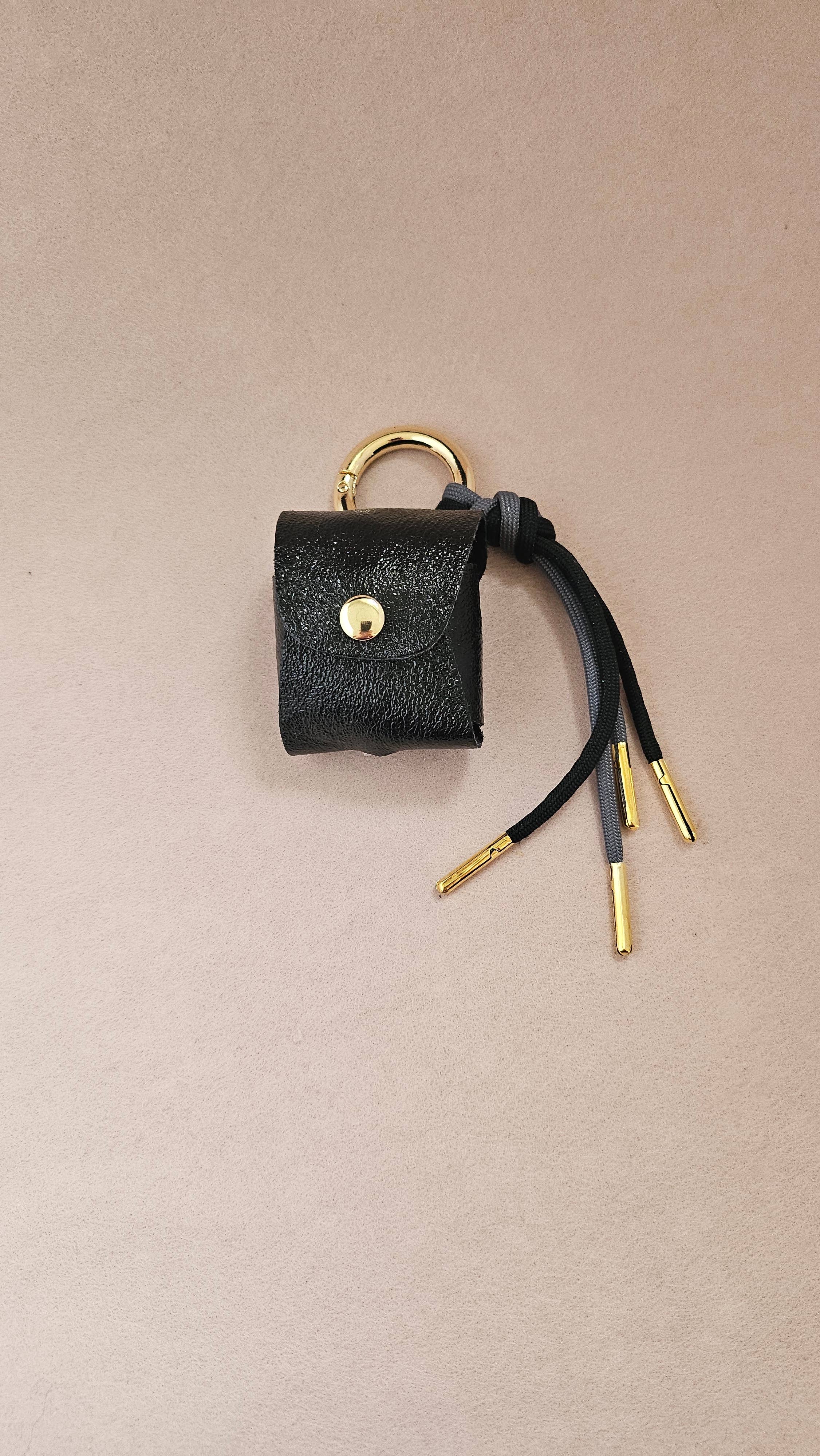 Leder-Kopfhörerhalter, Taschenanhänger: Mit Schnur / Canard